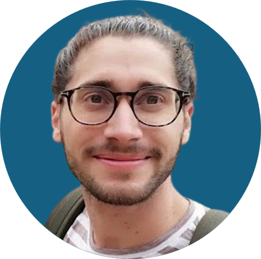 a profile photo of a man wearing glasses