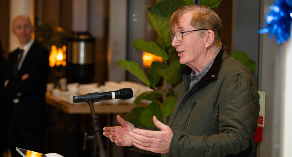 Professor Patrick Wall speaking at a podium