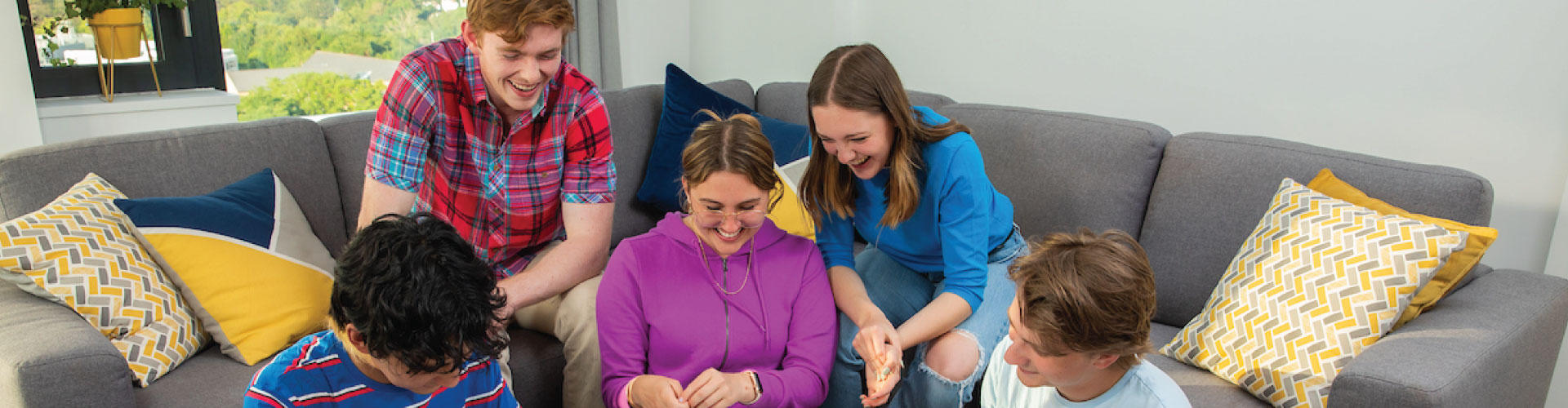 Group of international students together in living room of UCD student accommodation