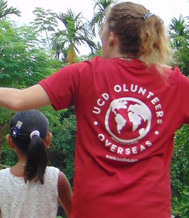 A UCD student wearing a red t-shirt that reads 