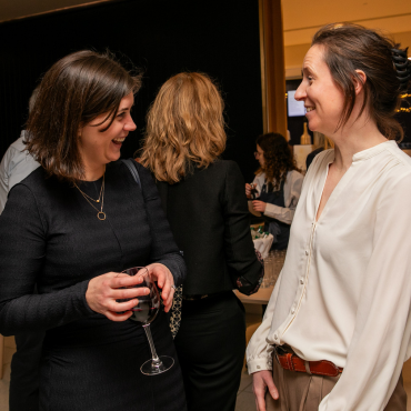 Two women chatting at the UCD Physiotherapy 70th anniversary celebration