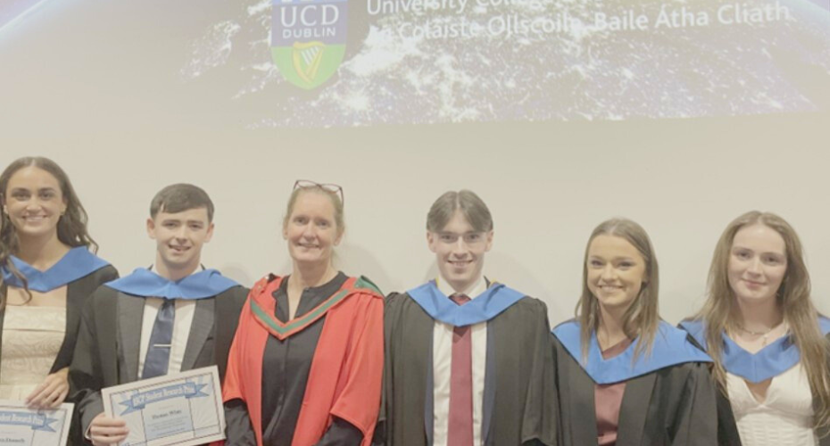 Graduates with an academic in a red gown