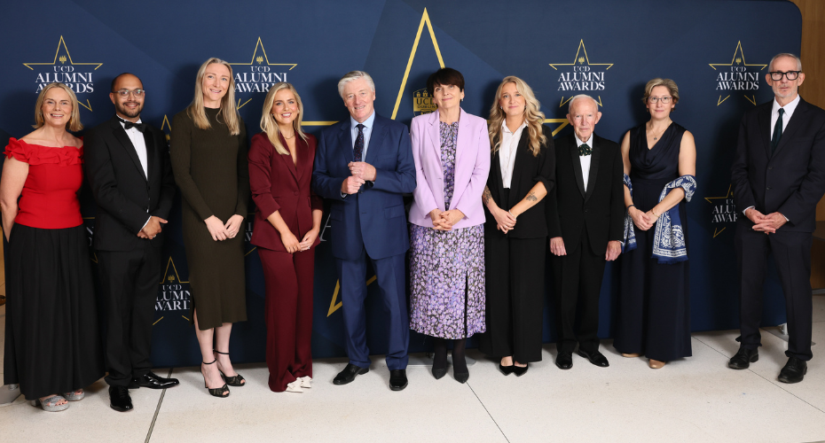 A group of people in front of a navy backdrop