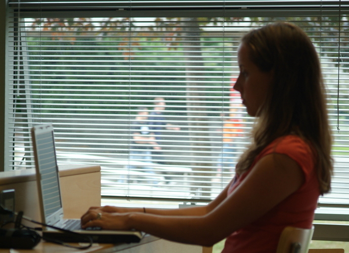Female student using on a laptop in the Daedalus building