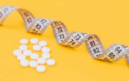 Measuring tape and pills